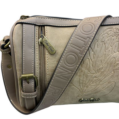 Cotton Road Sling Bag: KHAKI PU Leather with Embossed Protea and BRANDED Strap DETAIL VIEW