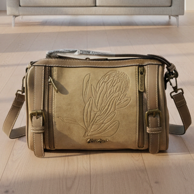 Cotton Road Sling Bag: KHAKI PU Leather with Embossed Protea and BRANDED Strap HERO