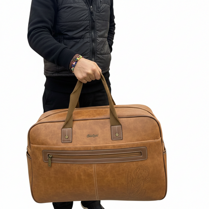 Cotton Road Travel Bag: BROWN PU Leather Overnight Duffel with Embossed Protea IN HAND