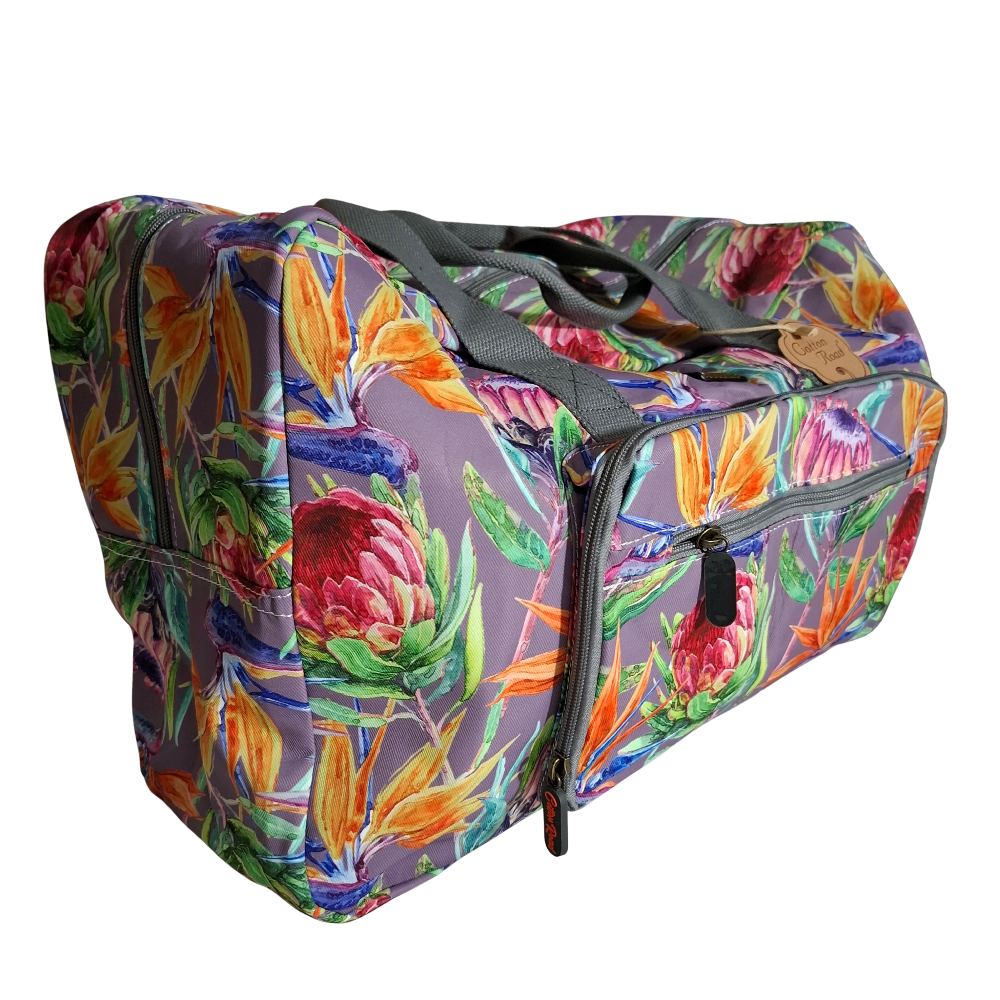 Cotton Road Travel Bag: Purple Soft Overnight Bag with Colourfull Protea detailing SIDE FRONT POCKET VIEW