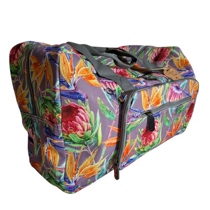 Cotton Road Travel Bag: Purple Soft Overnight Bag with Colourfull Protea detailing SIDE FRONT POCKET VIEW