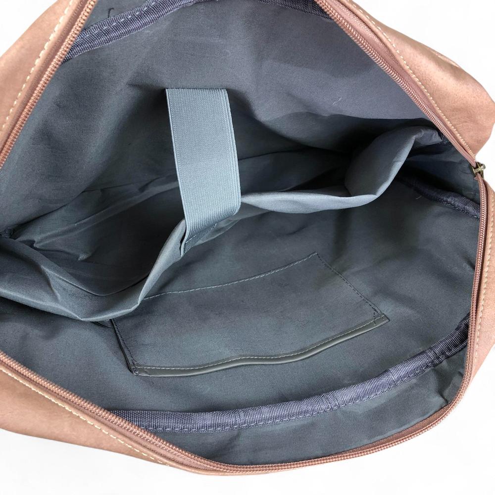 Interior view of PINK Cotton Road PU leather laptop bag with padded laptop pocket and zippered compartment