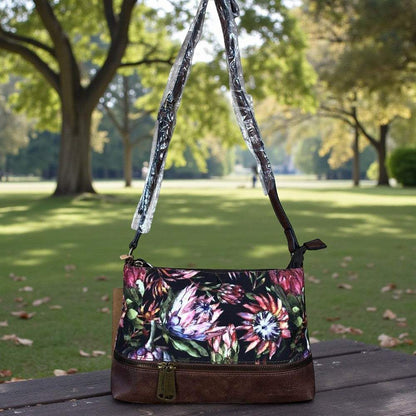 VIVACE Sling Bag: BLACK Canvas with PROTEA Print and BROWN PU Leather TRIM IN GARDEN