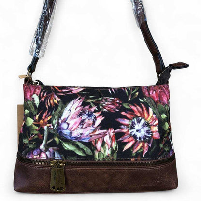 VIVACE Sling Bag: BLACK Canvas with PROTEA Print and BROWN PU Leather TRIM ON WHITE