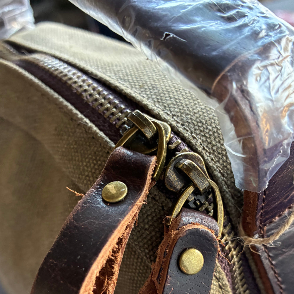 VIVACE CROSS BODY BAG: VINTAGE GREEN Canvas with Detailed Leather TOP ZIP CLOSURE DETAIL