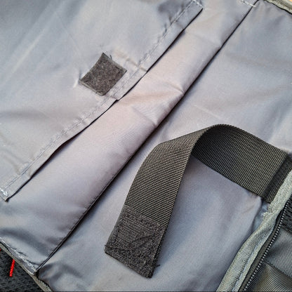 Close-up of padded pockets with a black strap used to secure laptop in the Vivace Blue Travel Backpack