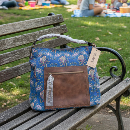 Vivace Handbag: BLUE Canvas Handbag with MULTICOLOUR FLOWERS and BROWN PU Leather Trim LIFESTYLE