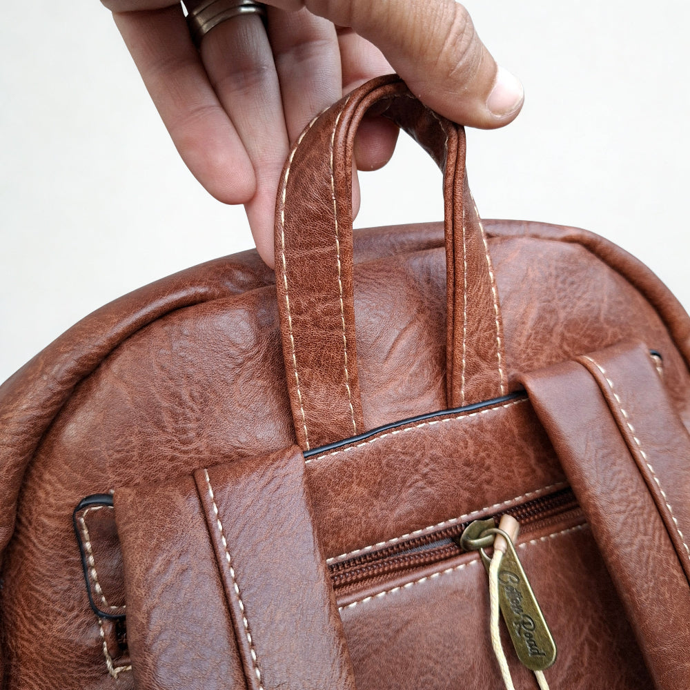 Cotton Road Backpack: BROWN PU Leather Laptop Backpack with Embossed flower stitching handle top