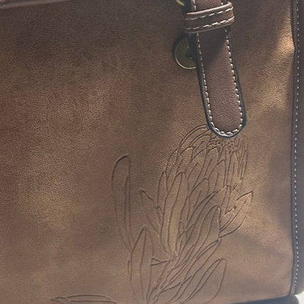 COTTON ROAD BACKPACK: BROWN PU Leather backpack with Embossed Proteas ZOOMED