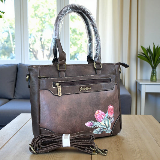 Cotton Road brown PU leather protea handbag, front view