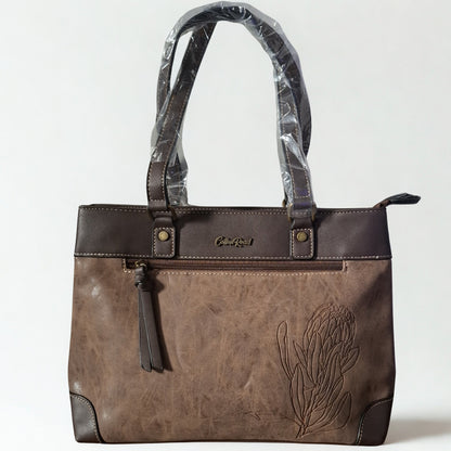 Cotton Road Handbag: COFFEE BROWN PU Leather Double Compartment Handbag with EMBOSSED Protea FRONT
