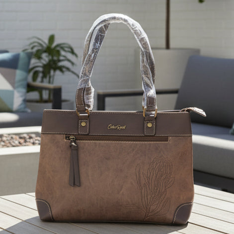 Cotton Road Handbag: COFFEE BROWN PU Leather Double Compartment Handbag with EMBOSSED Protea