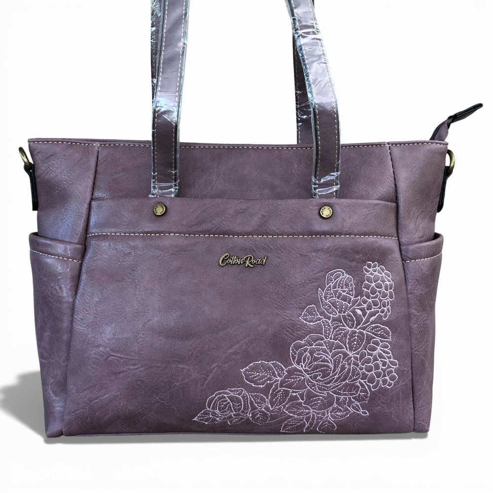 COTTON ROAD Purple tote handbag with floral embroidery and clear handles on a white background