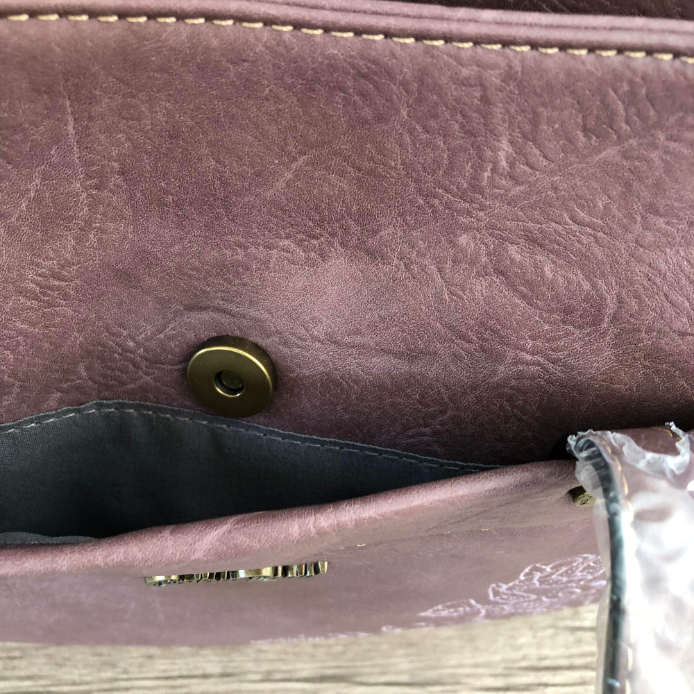 Close-up of a Cotton Road PU LEATHER textured purple bag with a button clip detail.