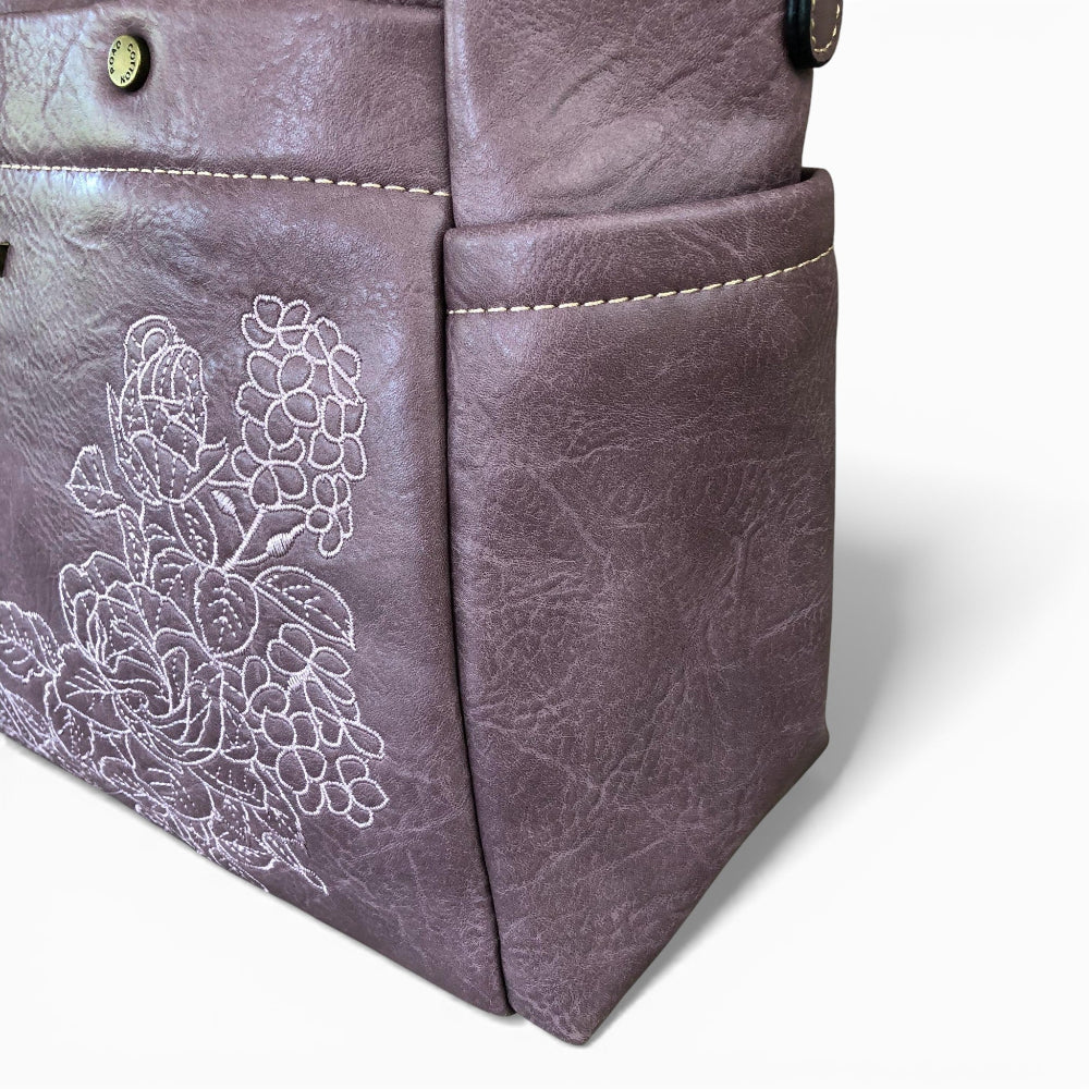 COTTON ROAD Purple PU leather bag with floral embroidery on a white background