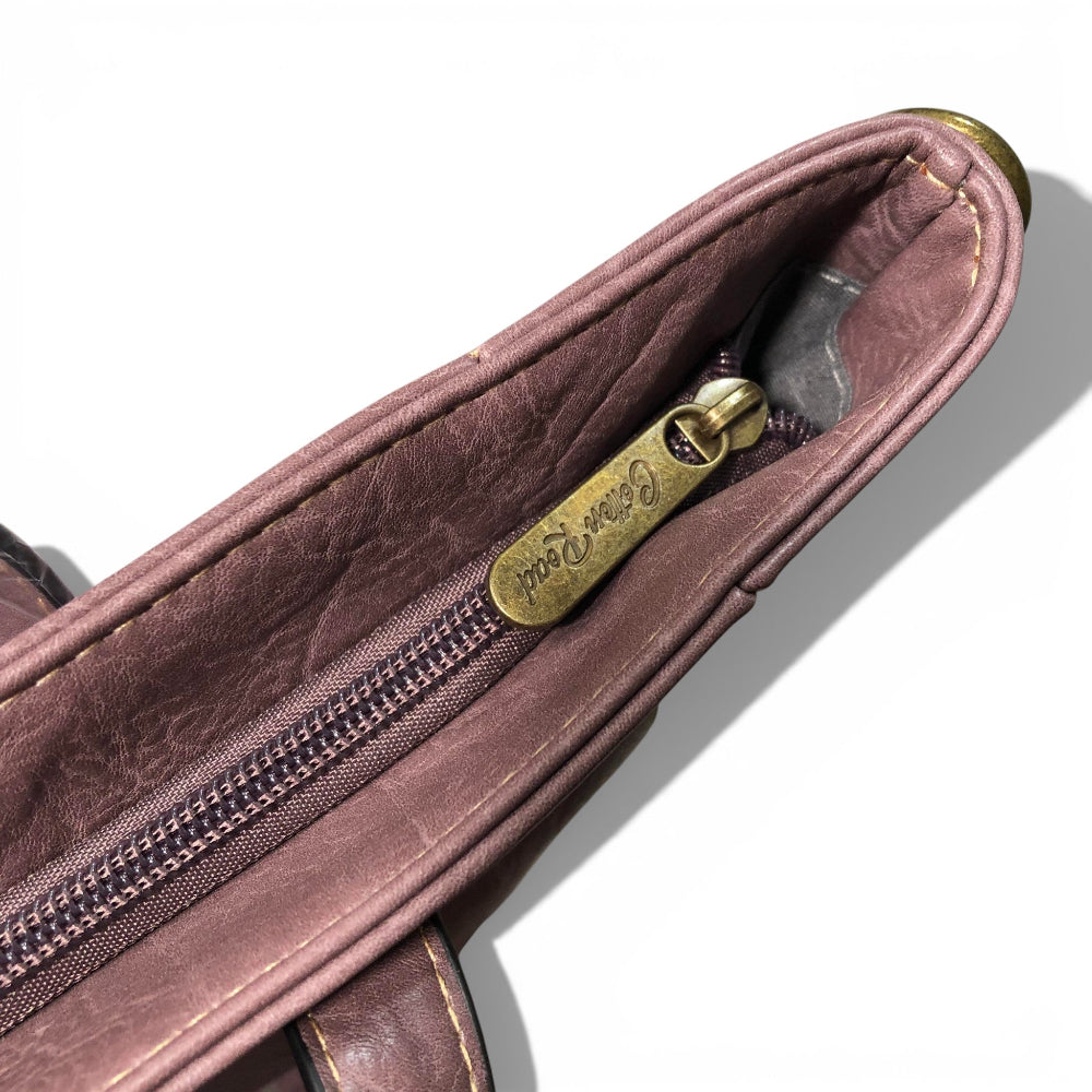 Close-up of a Cotton Road Purple PU leather bag with a gold zipper and brand logo on a white background