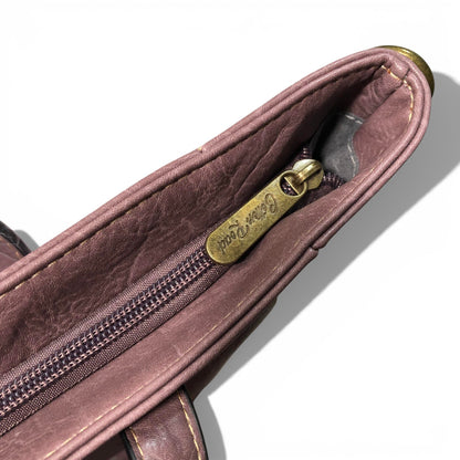 Close-up of a Cotton Road Purple PU leather bag with a gold zipper and brand logo on a white background