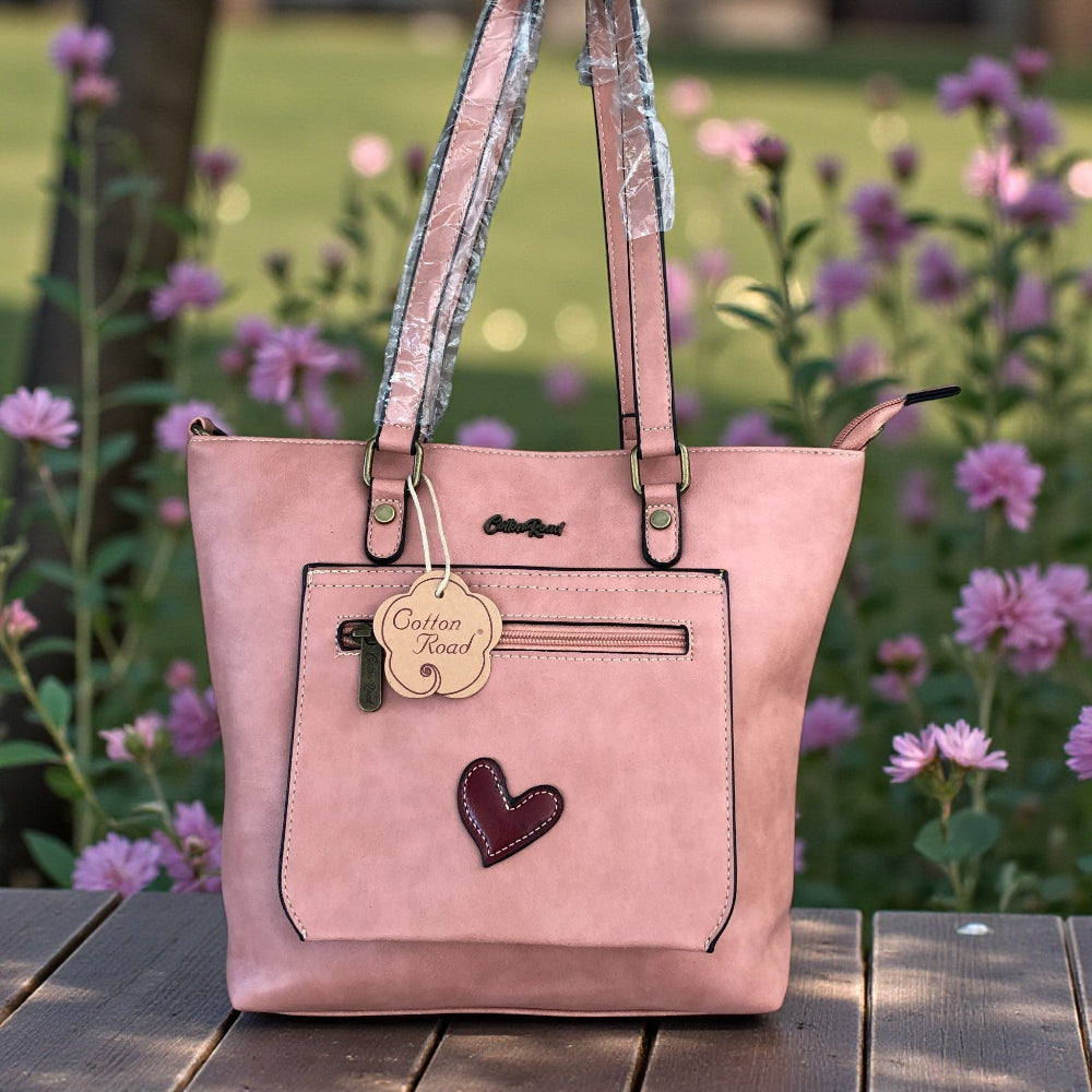 Cotton Road salmon pink PU leather handbag front view on table