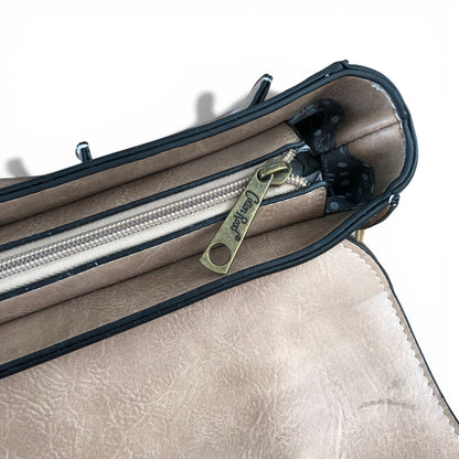 Cotton Road khaki handbag with windmill detailing upper zipper view. 