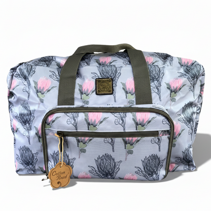 Cotton Road Travel Bag: Blue PVC Foldaway WEEKENDER Bag with PROTEAS UNFOLDED