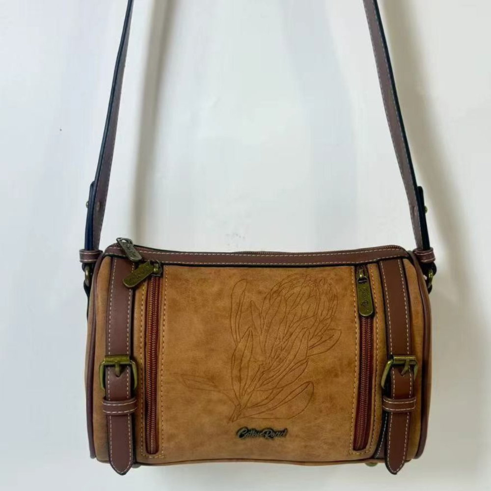 Cotton Road Sling Bag: BROWN PU Leather Sling Bag with Protea detailing and BRANDED Strap