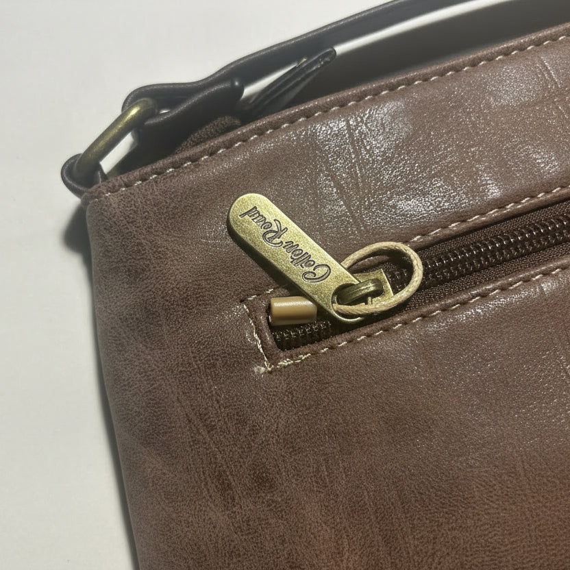 Cotton Road Sling Bag: COFFEE BROWN PU Leather Sling Bag with Embossed Protea ZOOMED