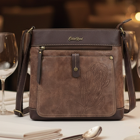 Cotton Road Sling Bag: COFFEE BROWN PU Leather Sling Bag with Embossed Protea LIFESTYLE