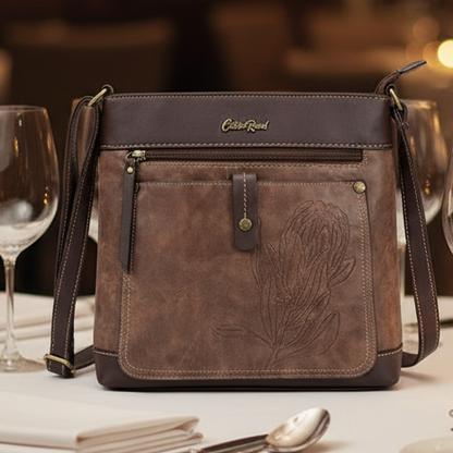 Cotton Road Sling Bag: COFFEE BROWN PU Leather Sling Bag with Embossed Protea LIFESTYLE