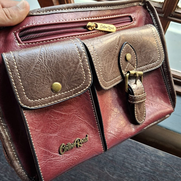 Cotton Road Sling Bag: RED PU Leather Bag with BROWN Trim and Buckle detailing