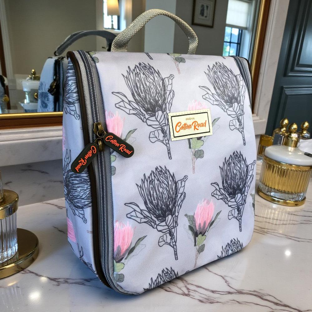 Cotton Road Toiletry Bag: BLUE PROTEA PVC Hanging Vanity Bag on washbasin