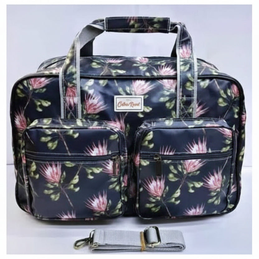 Cotton Road Travel Bag: BLACK PVC Overnight Bag with PROTEAS