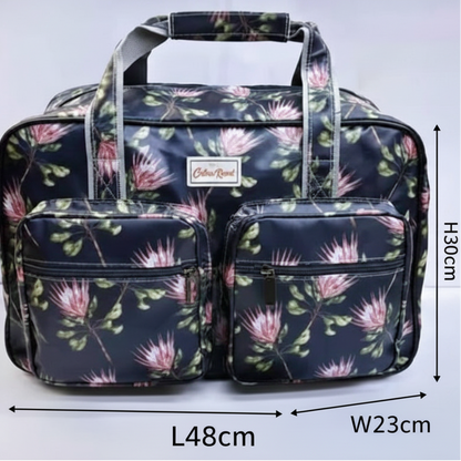 Cotton Road Travel Bag: BLACK PVC Overnight Bag with PROTEAS