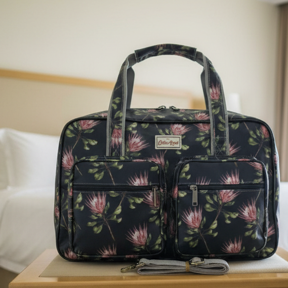 Cotton Road Travel Bag: BLACK PVC Overnight Bag with PROTEAS