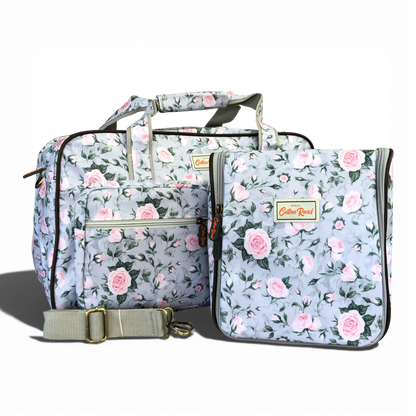 Grey Cotton Road travel bag with pink rose design and matching vanity bag in durable PVC material
