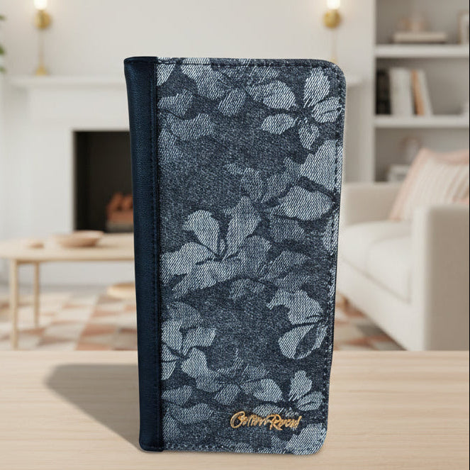 Cotton Road Wallet: Front of large black PU leather wallet with floral detailing in a bright living room