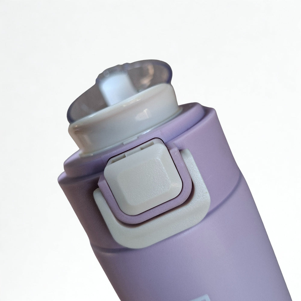 Press-button flip-top lid with safety lock on 500ml stainless steel thermal water bottle
