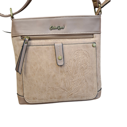 Cotton Road Sling Bag: KHAKI PU Leather with Embossed Protea