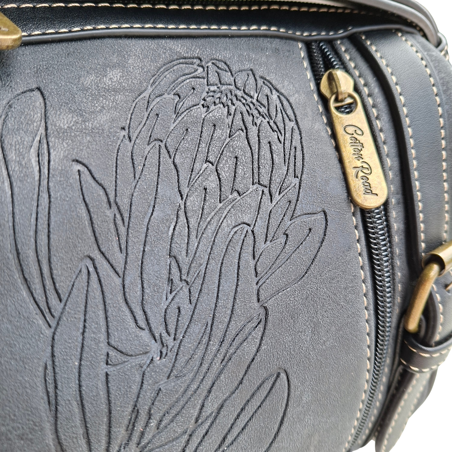 Cotton Road Sling Bag: BLACK PU Leather with Embossed PROTEA and BRANDED Strap