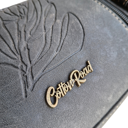 Cotton Road Sling Bag: BLACK PU Leather with Embossed PROTEA and BRANDED Strap