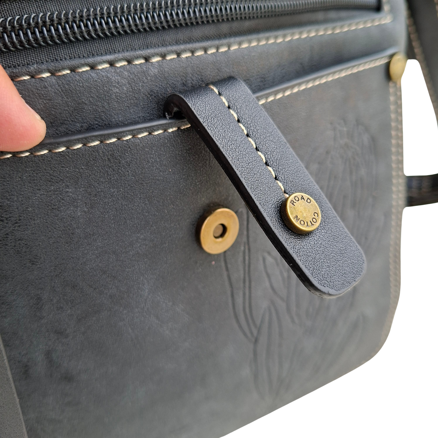 Cotton Road Sling Bag: BLACK PU Leather with Embossed Protea