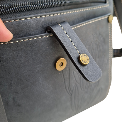 Cotton Road Sling Bag: BLACK PU Leather with Embossed Protea