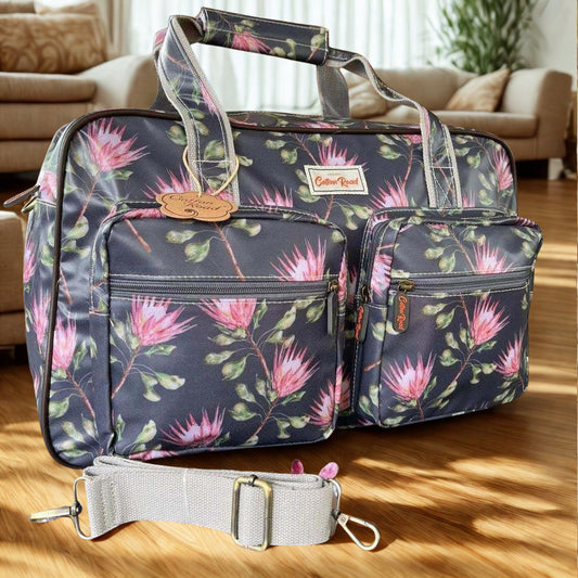 Cotton Road Travel Bag: DARK GREY PVC Overnight Bag with PROTEAS