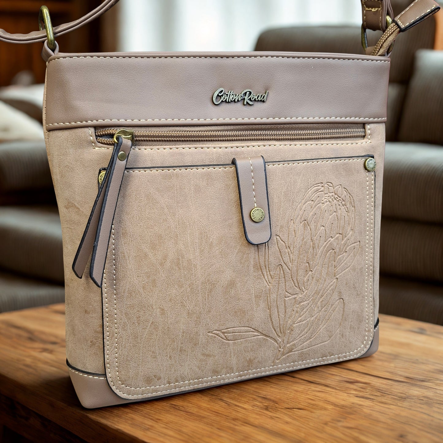 Cotton Road Sling Bag: KHAKI PU Leather with Embossed Protea