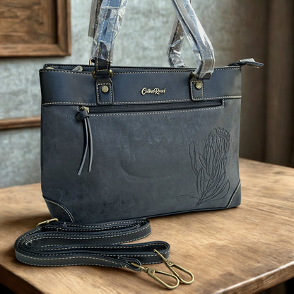 Cotton Road Handbag: BLACK PU Leather Double Compartment Handbag with EMBOSSED Protea