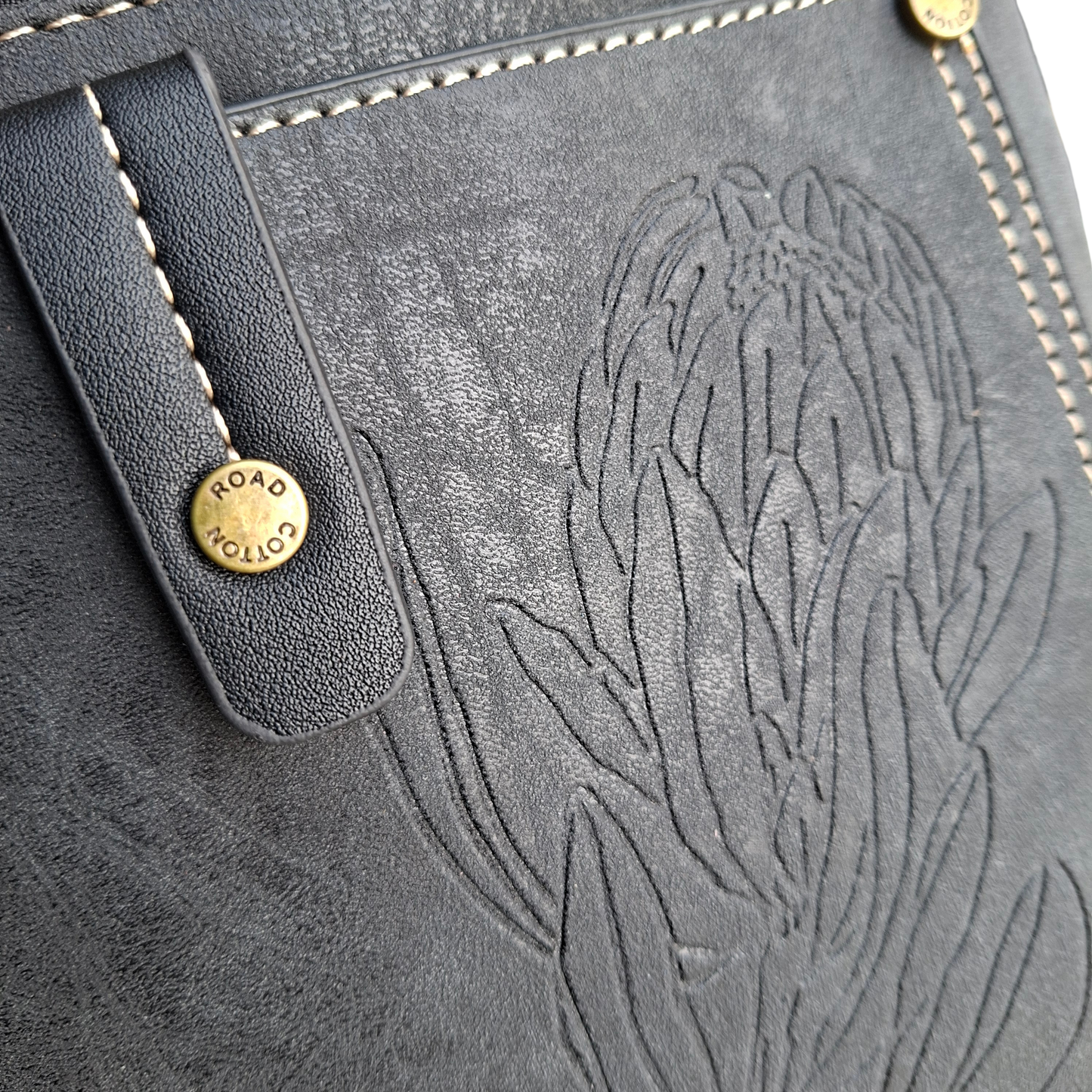 Cotton Road Sling Bag: BLACK PU Leather with Embossed Protea