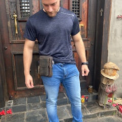 Vivace brown leather sling wallet front view on a belt 