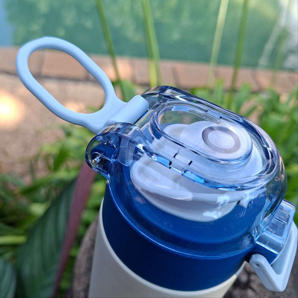 Blue MVP Bounce thermal bottle showing slimline design and carry handle, perfect for handbags and school backpacks and gym bags