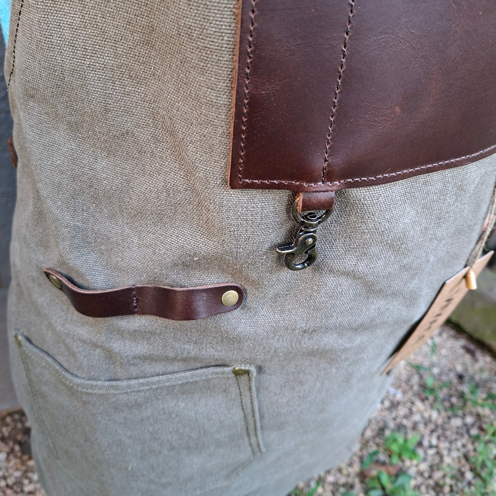A heavy-duty vivace waxed cotton apron leather and cotton pockets