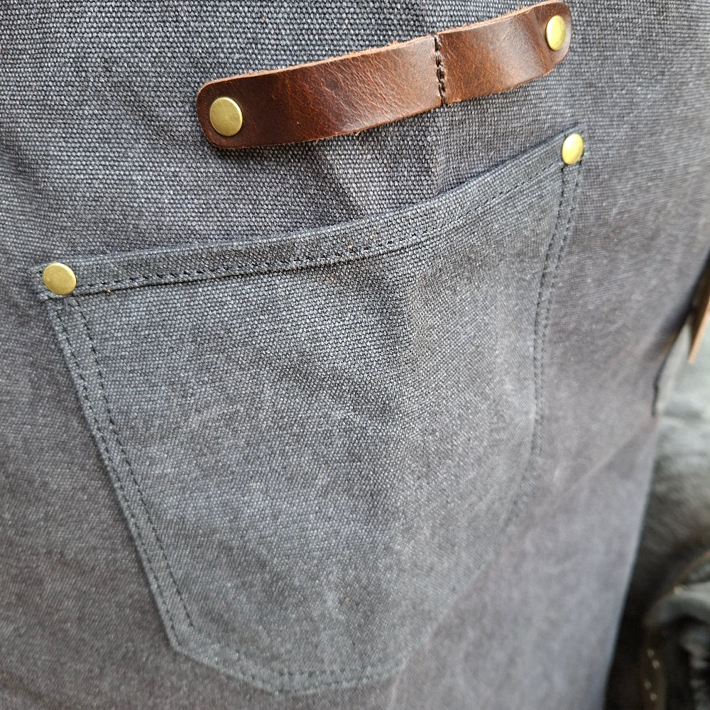 Waxed cotton apron front pocket detail