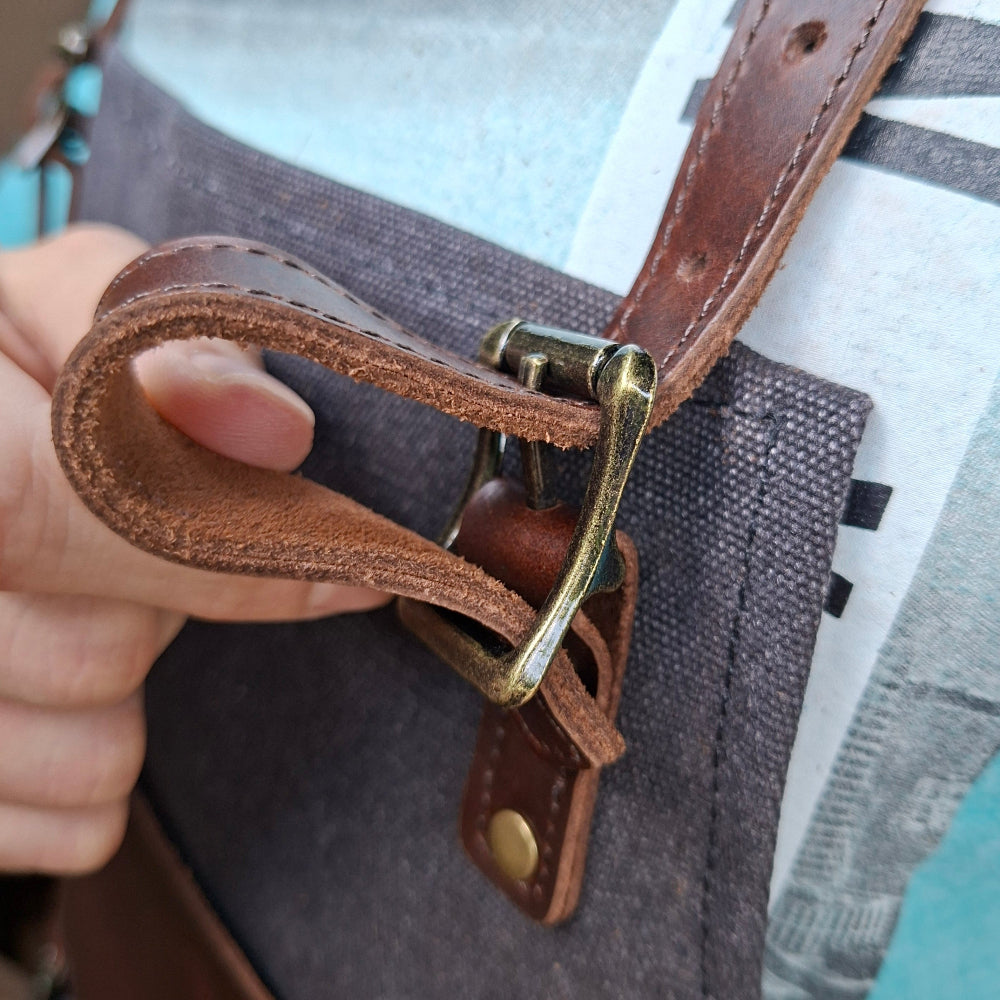 Vivace Waxed cotton apron front leather straps fastening detail